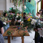 Group shot of flower workshop class, students creating their arrangements with Australian grown flowers.