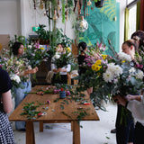 Group shot of flower workshop class, students creating their arrangements with Australian grown flowers.