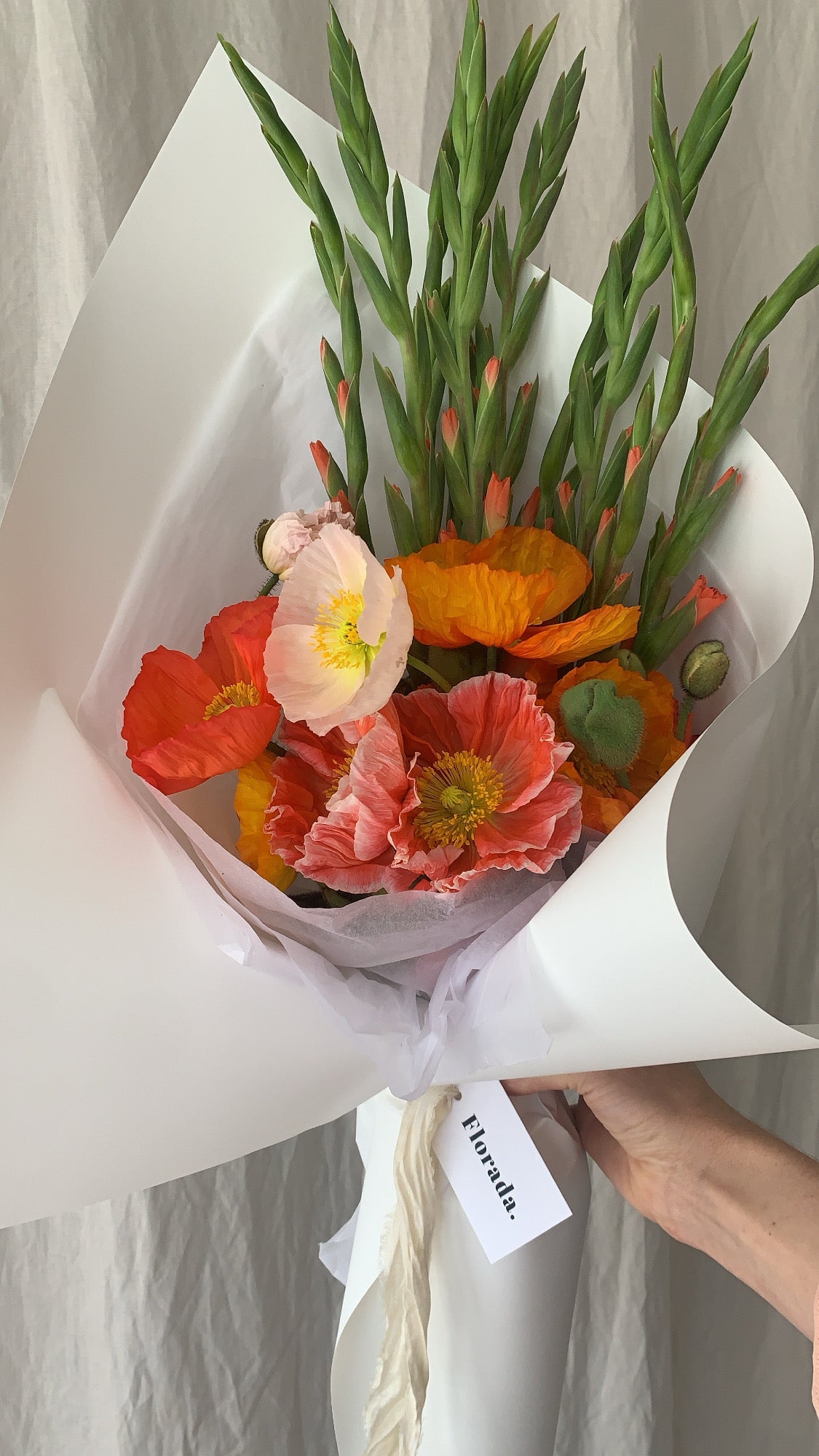 Posie of colourful poppies and mini gladioli wrapped in Florada gift wrap and silk ribbon, 